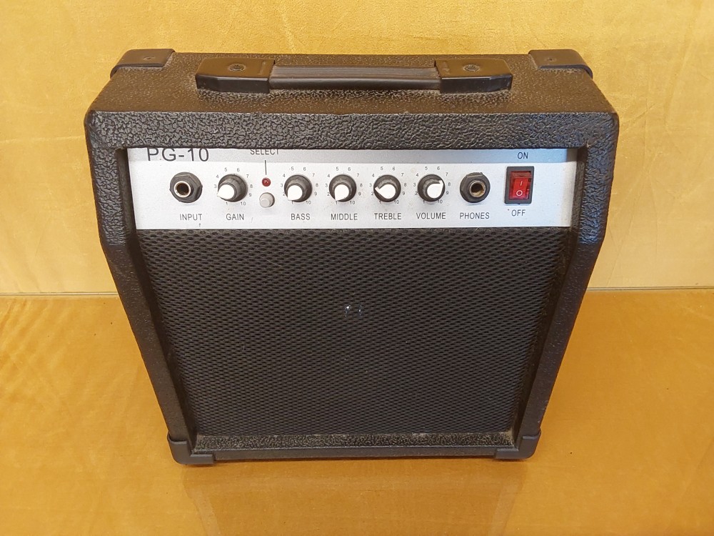 GUITARE ÉLECTRIQUE SL + AMPLI PG-10 + SACOCHE + DIVERS LIVRES DE MUSIQUE