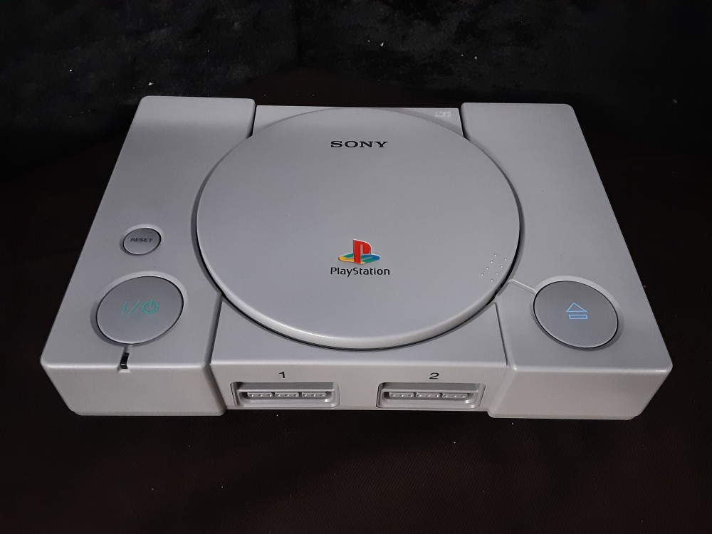CONSOLE PS1 AVEC 2 MANETTES ET CABLES