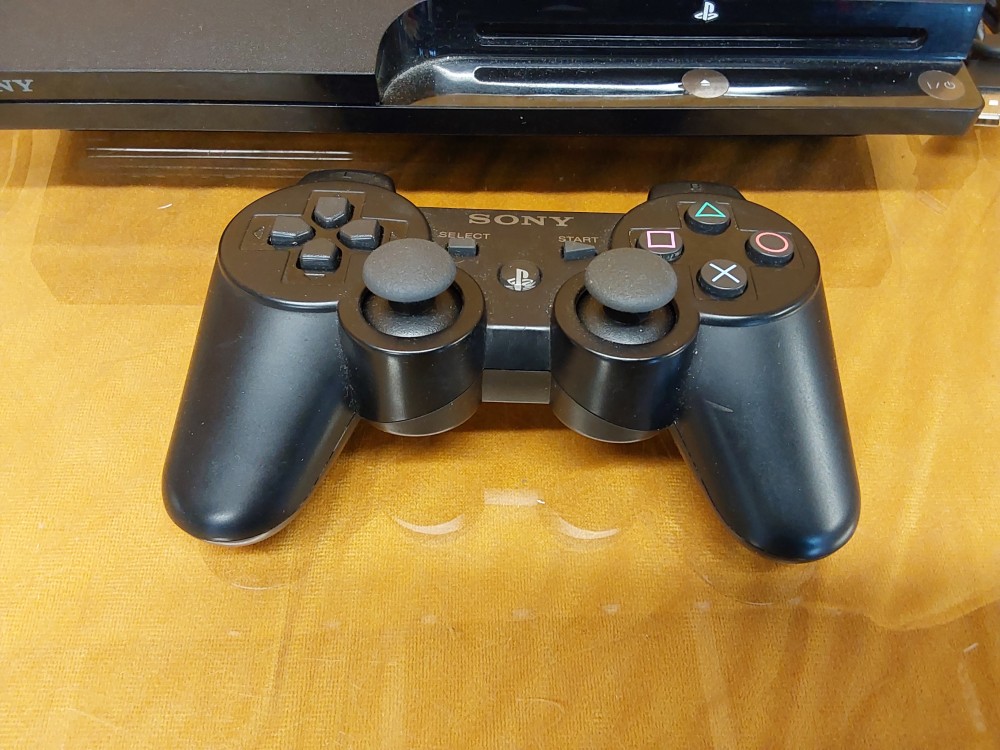 CONSOLE PS3 SLIM AVEC 1 MANETTE ET CABLES