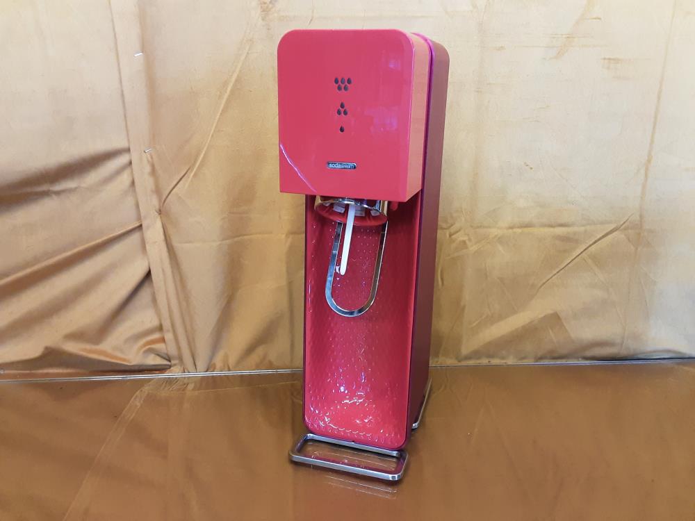 SODA STREAM ROUGE AVEC CONSIGNE VIDE À L'INTERIEUR